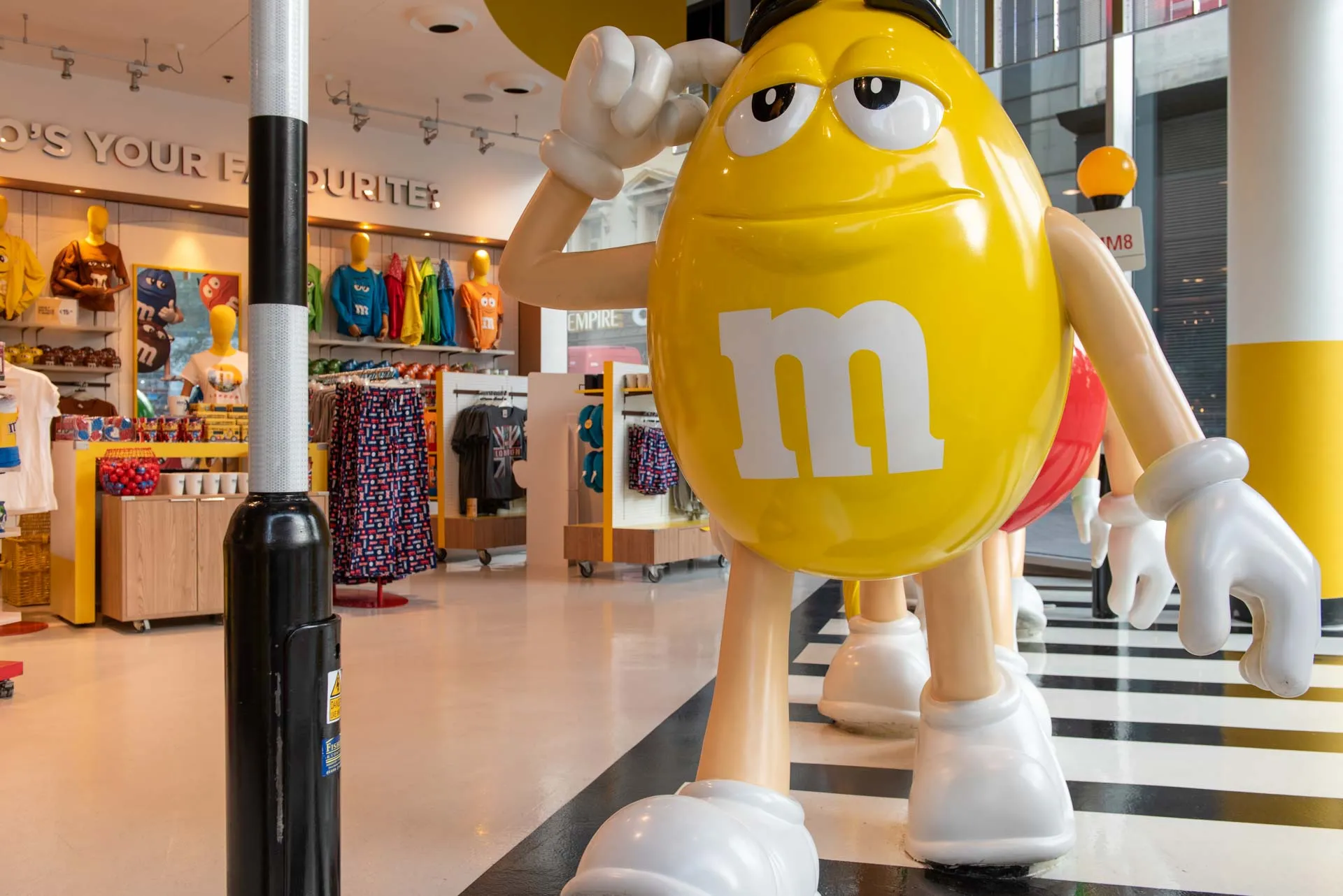 Visitors at M&M World London chocolate wall unveiling — event photography by Thinksay