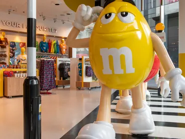 M&M World London visitors at chocolate wall
